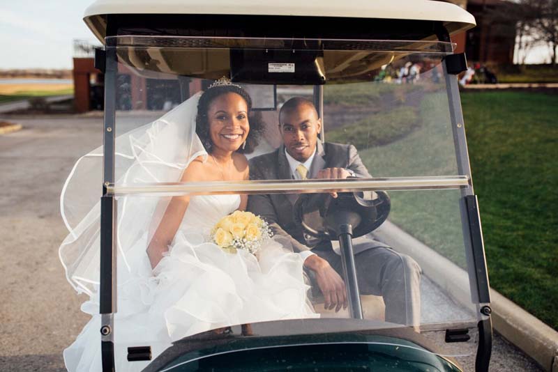 bride and groom on a golf cart